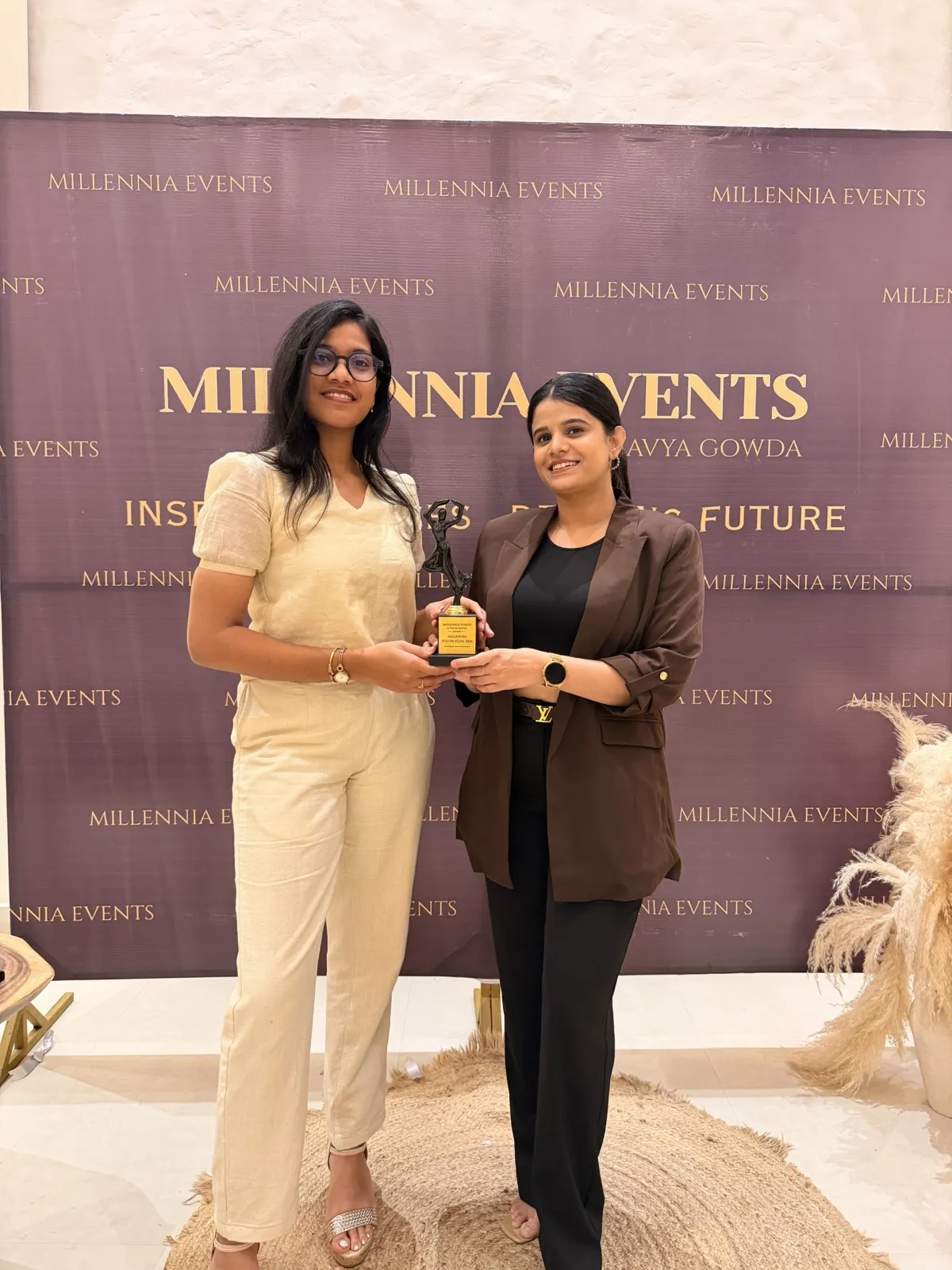 An honouree receiving a Millennia award, Bengaluru edition